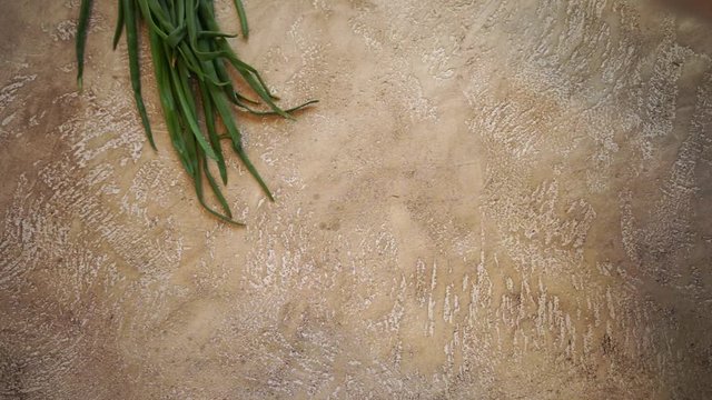 making a frame from raw vegetables on a beige cement background with copy space for your text