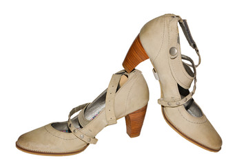Women's beige pumps on an isolated background.
