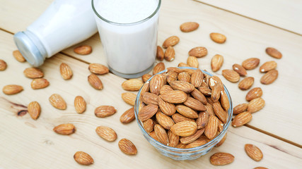 Almond milk on a wooden table.