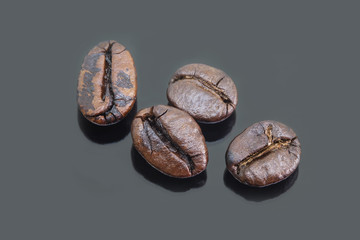 Coffee beans isolated on gray background.