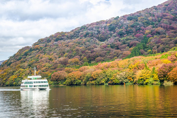 Fototapeta na wymiar Ferry at Lake Ashi, Autumn Landscape with colorful forest