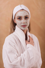 Spa Woman applying Facial Mask