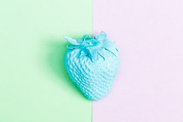 Painted strawberry on bright background