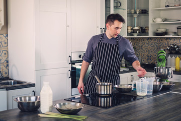 Chef cook working on a modern kitchen at home