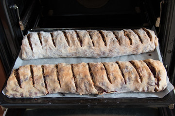 Two apple strudel in the oven
