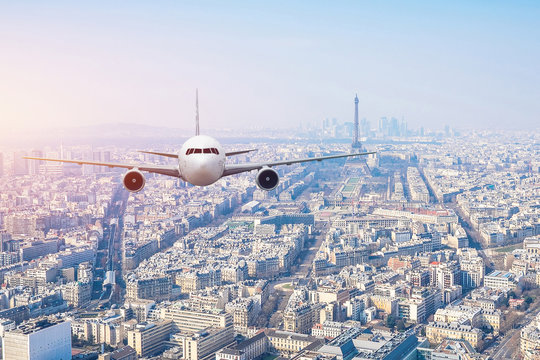 Airplane frying over the center of Paris, France
