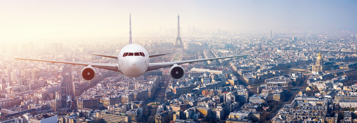 Airplane frying over the center of Paris, France