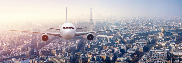 Fototapeten Airplane frying over the center of Paris, France © sahachat