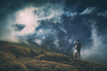 Hiker standing on a hill. Instagram stylization