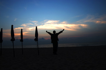 Fototapeta premium silhouettes on beach at sunrise