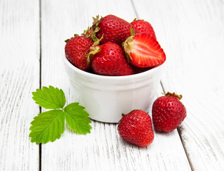 ripe strawberries on wooden table