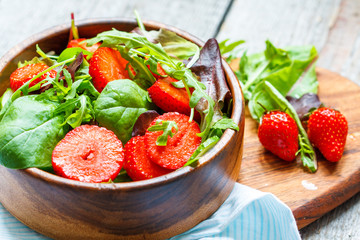 Summer bright salad with strawberries. Weight loss on a vegan diet concept.