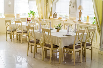 Elegant served tables and chairs indoors