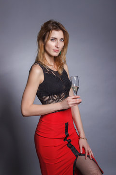 Beautiful girl with a glass of wine