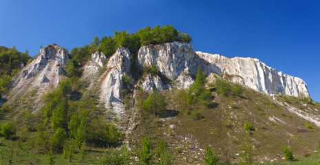 Ancient chalk mountains in central Russia. A landscape view of the peaks and hills.