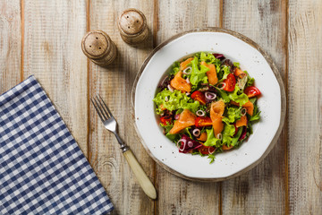 Fresh salad with smoked salmon.