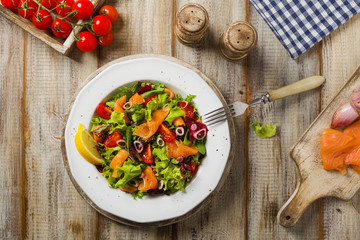 Fresh salad with smoked salmon.