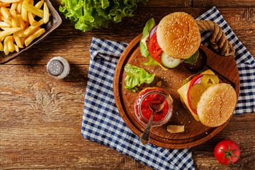 Homemade, beef hamburger with cheese and vegetables.
