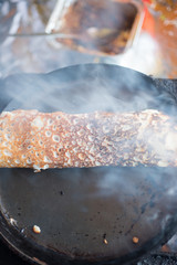 Indian dosa roll cooking in hot pan