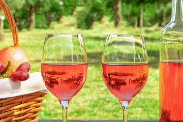 Two glasses of rose wine at picnic with copyspace