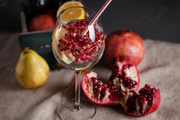 Glass with a drink of pomegranate and lemon