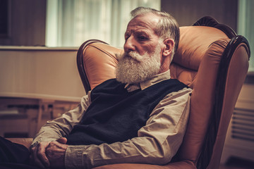 Well-dressed senior man in luxury interior