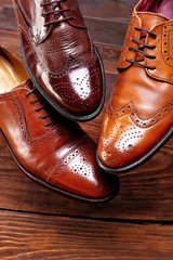 Fashion classical polished men's brown oxford brogues shades of brown oxford brogues.Conept flying shoes.Closeup