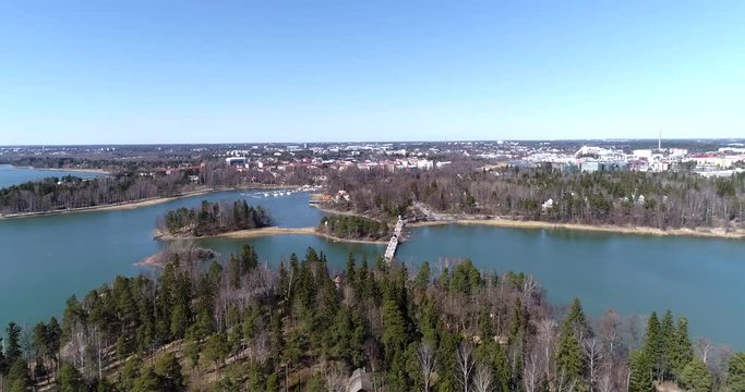 Seurasaari bridge, Cinema 4k aerial view of a flight over seurasaari and seurasaaren silta, on a sunny spring day, in Helsinki, Finland