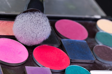 Eye shadow palette in natural colours and makeup brushes