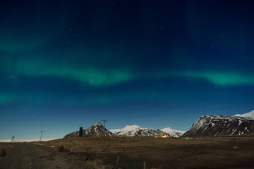 Obraz na płótnie Canvas Northen lights over the mountain in Iceland