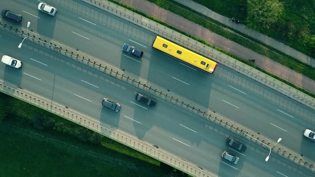 Evening highway traffic. 4K aerial video, top down view