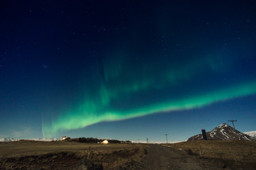 Fototapeta na wymiar Northen lights over the mountain in Iceland