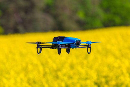 Drone Flying Over Blossom Rapeseed Field