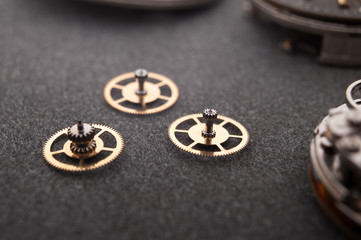 Detail of watch machinery on the table.