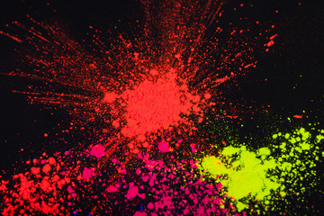 Face powder on a black background, abstract