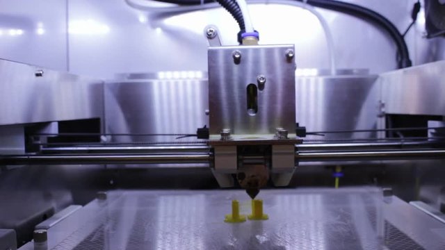 Close up 3D Printing process to build work pieces ;  industrial manufacturing equipment background