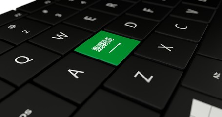 3D rendering close up of Saudi Arabia flag button on laptop keyboard.