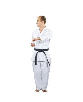 Sportsman is training formal exercises of karate