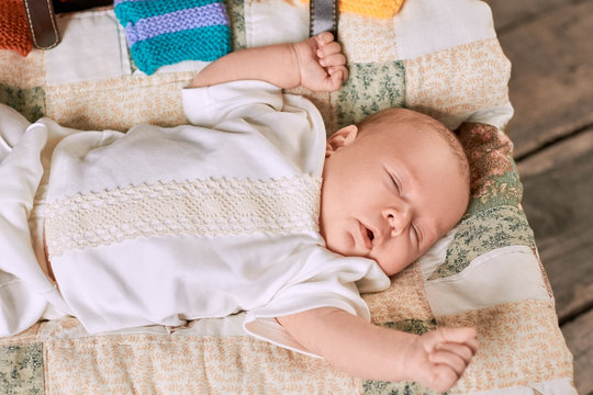 Infant with eyes closed. Small caucasian kid. Baby sleeping time.