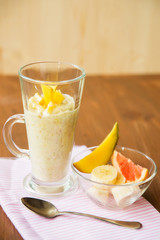 Banana smoothie on a rustic wooden table