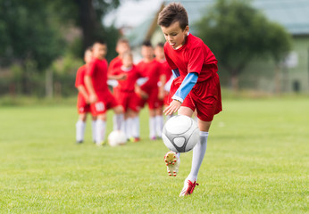 Kids soccer football - children players match on soccer field