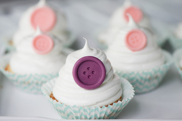 Basket of cream in a paper wrapper.Culinary syringe. beautiful cream hat decorated with buttons