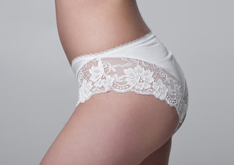 Close up of slim fit healthy girl in white panties