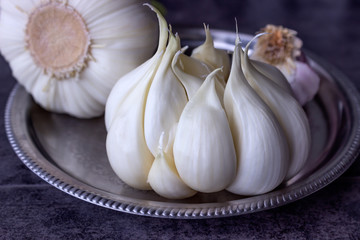 Fresh garlic on a dark background.