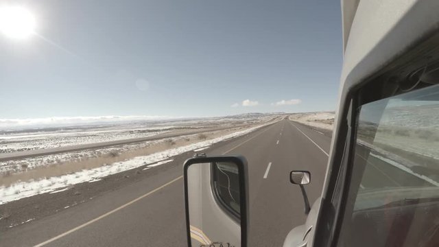 Forward facing footage from the exterior of a Semi Truck traveling down a rural US Highway.