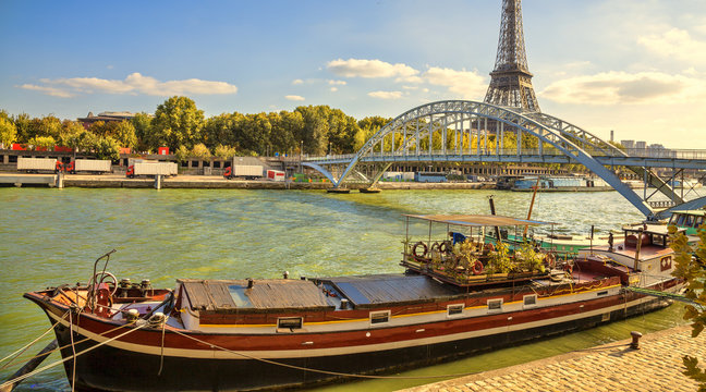 Houseboat in Paris. Houseboat on the Seine river. Eiffel tower.