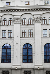Fragment of old building with balcony and bas-relief (Stalin's empire) in Minsk, Belarus