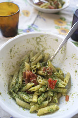 pasta with pesto sauce ad cherry tomatoes