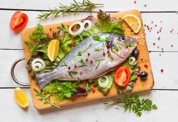 Raw fish with herbs and spices, ready to cook