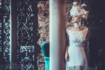 Elegant wedding dress and crown. Gorgeous woman. Tender bride in